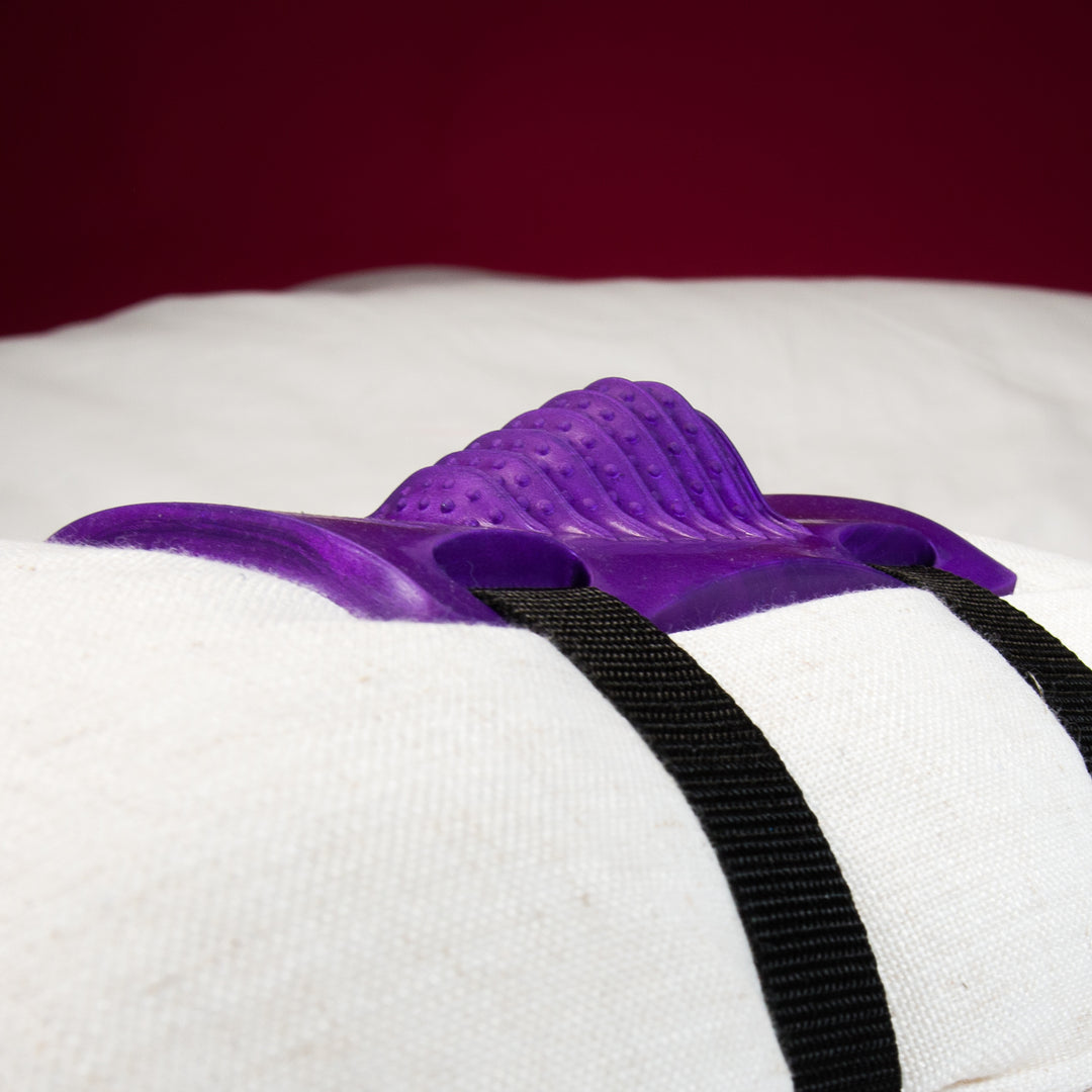 Purple Grinding Sex Toy on cushion