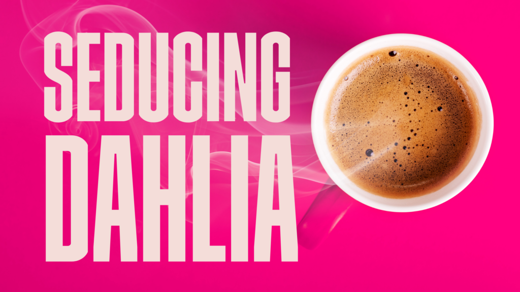 Cup of coffee on pink table and words seducing dehlia